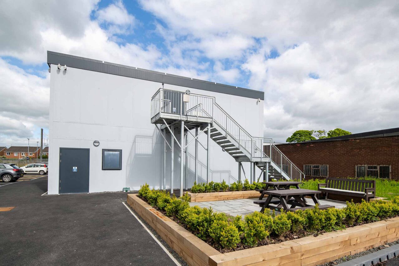 image of garden area next to refurbished modular building