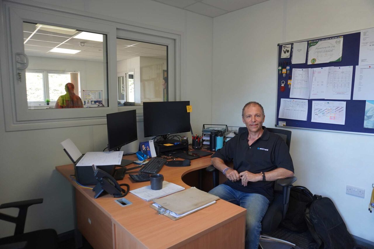 Image of client sat at desk